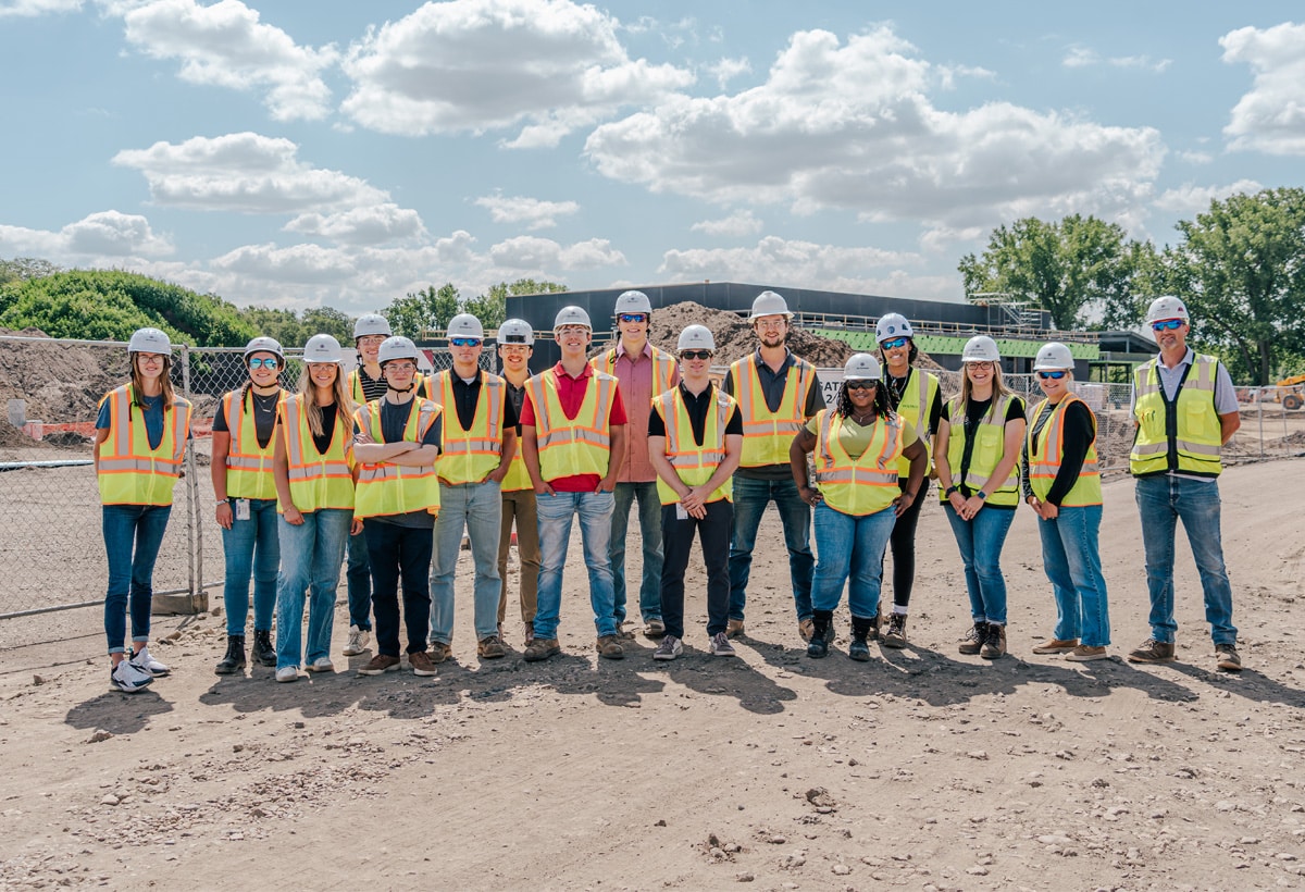 Diverse group of McGough interns in protective gear on a work site